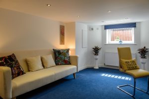Basement Conversion with sofa and desk for an office with living area. Moorland Road, Didsbury, Greater Manchester