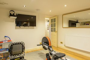 Dean’s Green House, Lymm - Cellar Conversion to create recreational area for exercise including rowing machine, gaming and more