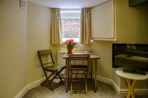 Orchard Street, Didsbury - Basement conversion living area with dining table and chairs
