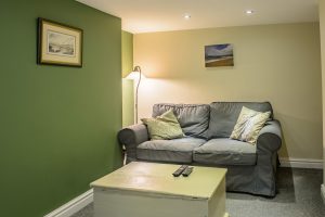 Orchard Street, Didsbury - Basement conversion living area with sofa